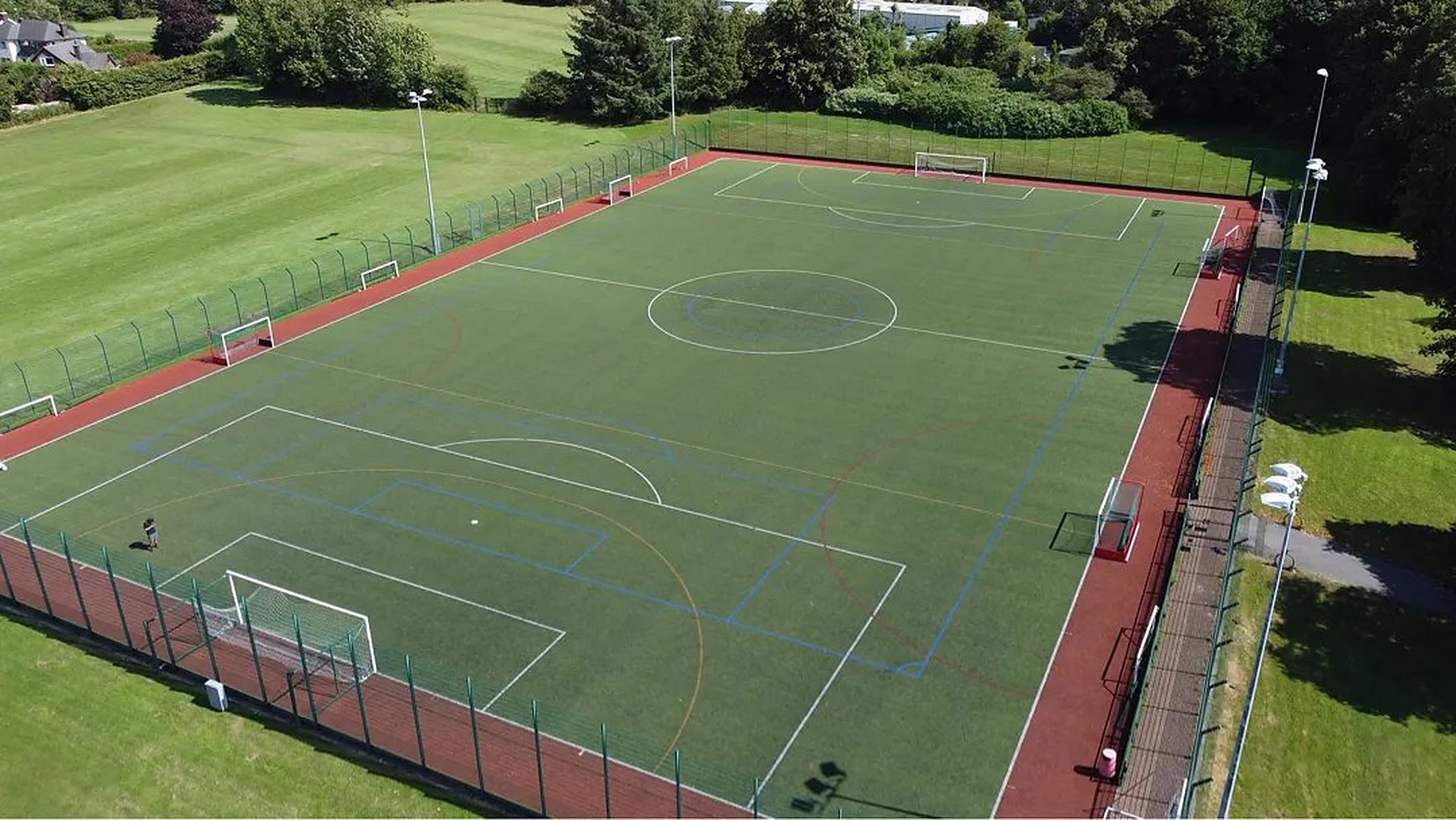 Aerial view of a finished, line-marked artificial sports pitch by Envirolawn